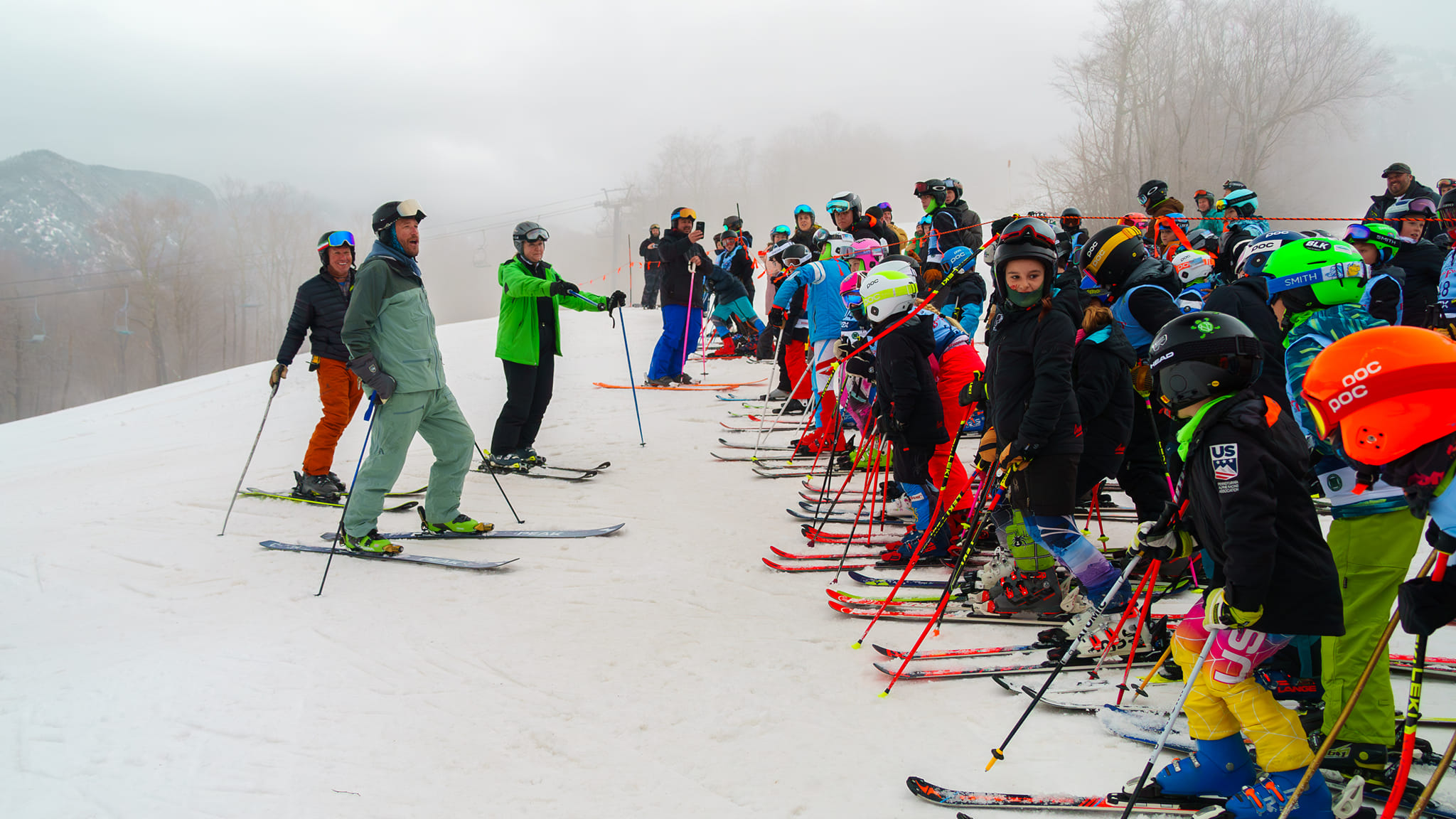Bode Miller at the starting line with kids lined up to ski with him at bode fest 2024