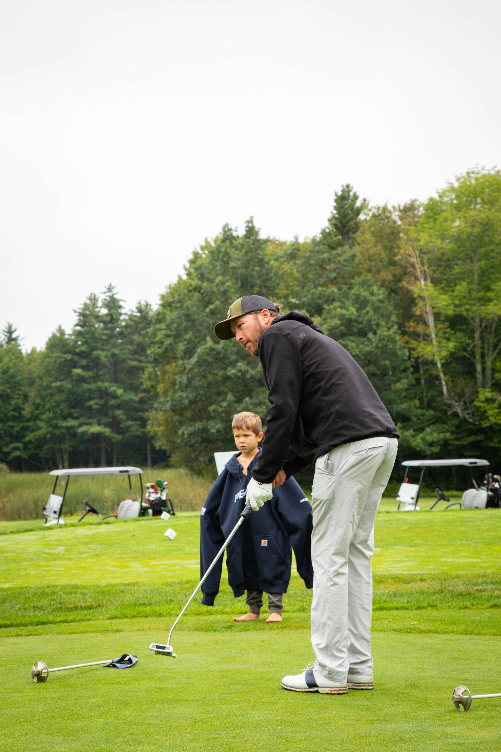 Bode Miller and son golfing at Bode Bash Summer Classic fundraiser